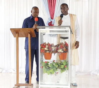 Two speakers at the front of a church
