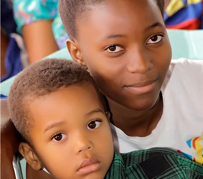 Two children seated close together